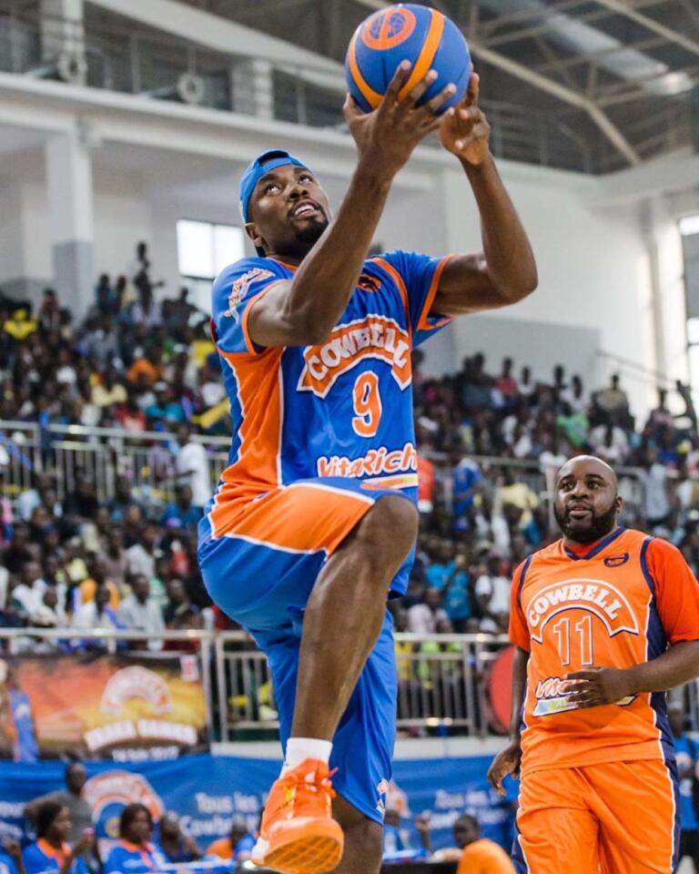 Player shooting basketball in action.